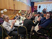 A table clapping along to the music