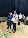 Ellie presenting Andy with certificate