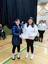 Ellie presenting Karla with certificate