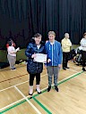 Ellie presenting Kaylee-Ann with certificate