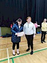 Ellie presenting Louise with certificate