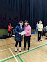 Ellie presenting Anna with certificate
