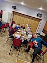 Children sitting at a table eating their Christmas Lunch