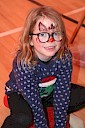 Smiling child with reindeer face paint on