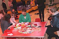 A group of people sitting around speaking